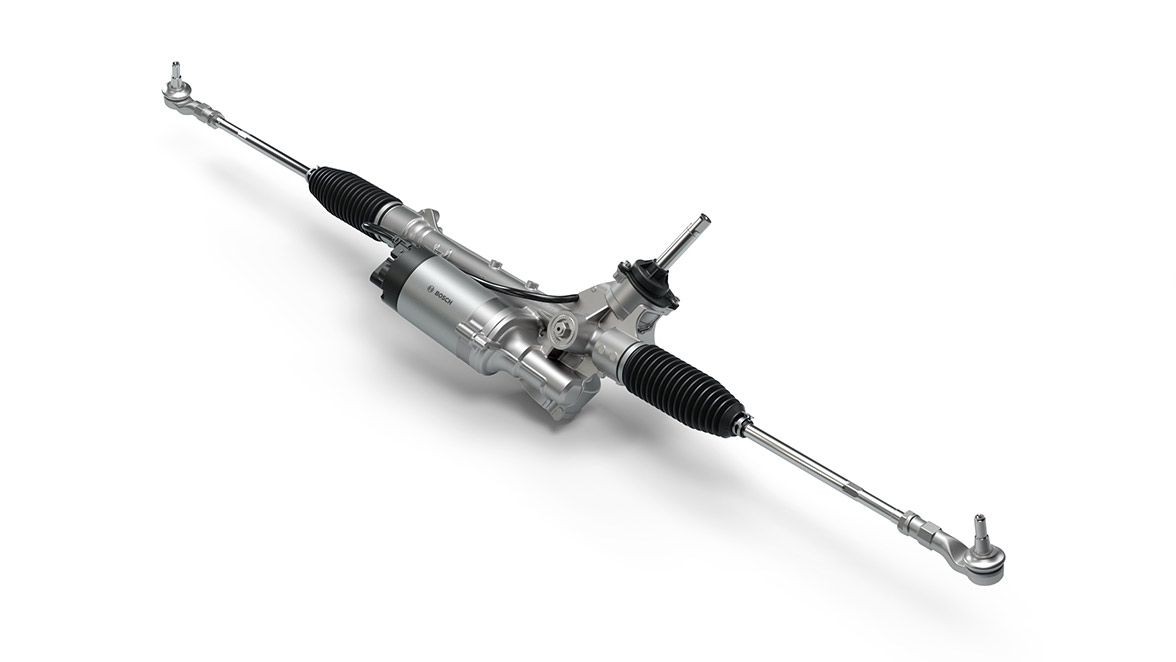 Close-up view of a car's power steering rack on a white background.